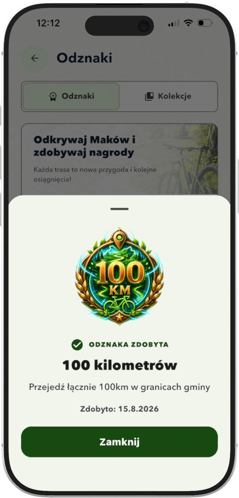 Ekran aplikacji z odznaką za przejechanie 100 kilometrów